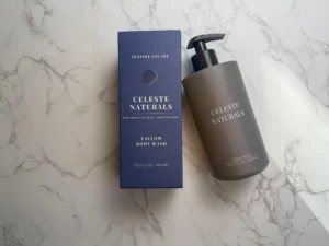 CELESTE NATURALS Seaside Escape Body Wash bottle and box on marble background